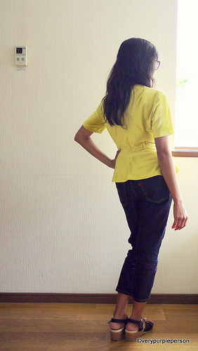 Peplum top and ankle-length jeans