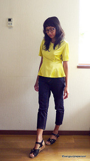 Peplum top and ankle-length jeans